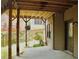 Covered patio overlooking a garden, with access to the home's exterior door at 5122 Micaela Way, Duluth, GA 30096