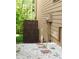 Property side-yard featuring stone landscape with retaining wall and direct-access to the yard at 5122 Micaela Way, Duluth, GA 30096