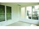 Inviting sunroom with white walls, light floors, and lots of natural light at 5122 Micaela Way, Duluth, GA 30096