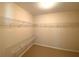 Walk-in closet with carpet and multiple wire shelves for storage at 5122 Micaela Way, Duluth, GA 30096