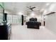 Stylish bedroom with tray ceiling, a ceiling fan, and large windows for natural light at 811 Flathead Pass, Suwanee, GA 30024