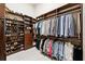 Spacious walk-in closet with custom shelving, ample hanging space, and organized shoe racks at 811 Flathead Pass, Suwanee, GA 30024