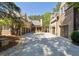 Spacious driveway leading to multiple garage doors, providing ample parking at 811 Flathead Pass, Suwanee, GA 30024