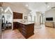 In-law suite kitchenette with wood cabinets, stainless steel appliances, and hardwood floors at 811 Flathead Pass, Suwanee, GA 30024