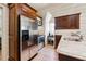 Close-up of in-law suite kitchenette with stainless steel appliances and modern fixtures at 811 Flathead Pass, Suwanee, GA 30024