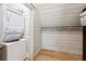 A well organized laundry room with washer and dryer and closet at 811 Flathead Pass, Suwanee, GA 30024