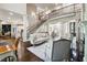 Open-concept living room featuring a staircase with iron railings and luxury decor at 811 Flathead Pass, Suwanee, GA 30024