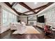 Cozy living room with stone walls, hardwood floors, coffered ceilings, and a fireplace at 811 Flathead Pass, Suwanee, GA 30024