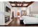 Luxury main bedroom with a fireplace, hardwood floors, and decorative archways at 811 Flathead Pass, Suwanee, GA 30024