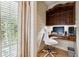 Charming office nook with built-in desk, natural light, and white shiplap walls at 811 Flathead Pass, Suwanee, GA 30024