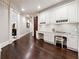 Hallway office space with custom cabinets, desk space, and hardwood floors at 811 Flathead Pass, Suwanee, GA 30024