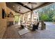 Outdoor living area with brick fireplace and comfortable seating at 811 Flathead Pass, Suwanee, GA 30024