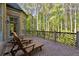Outdoor patio with brick flooring, lounge chairs, and privacy with natural forest surroundings at 811 Flathead Pass, Suwanee, GA 30024