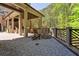 Outdoor patio with built in fire pit with wood chairs and table at 811 Flathead Pass, Suwanee, GA 30024