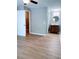 Neutral bedroom boasts hardwood floors and features a private ensuite bathroom and walk in closet at 310 Warm Springs Cir, Roswell, GA 30075