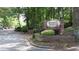 Roswell Springs sign near the community entrance and tree-lined street at 310 Warm Springs Cir, Roswell, GA 30075