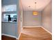 Open floor plan from dining area to updated kitchen with stainless appliances at 310 Warm Springs Cir, Roswell, GA 30075