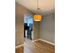 Dining area with pendant lighting looks over kitchen featuring stainless steel appliances at 310 Warm Springs Cir, Roswell, GA 30075