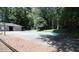 Community pool surrounded by trees and greenery at 310 Warm Springs Cir, Roswell, GA 30075