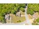 Aerial view of property showcasing the home and large, green yard surrounded by trees at 4309 Milford Pl, Hoschton, GA 30548