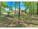 Backyard with mature trees providing ample shade and privacy at 4309 Milford Pl, Hoschton, GA 30548