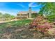 Green backyard with lush landscaping, a deck, and a traditional home at 4309 Milford Pl, Hoschton, GA 30548