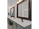 Bathroom boasting double sinks, framed mirrors, and gray cabinetry at 4309 Milford Pl, Hoschton, GA 30548