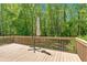 Spacious deck with wood railing, perfect for outdoor entertaining at 4309 Milford Pl, Hoschton, GA 30548