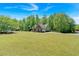Sprawling lawn surrounds this well-maintained brick home, offering ample outdoor space and curb appeal at 4309 Milford Pl, Hoschton, GA 30548