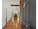 Inviting foyer with hardwood floors, high ceilings, and a glimpse of the living room with a fireplace at 4309 Milford Pl, Hoschton, GA 30548