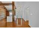 Elegant entryway with hardwood floors, exposed beams, and an open view to the living spaces at 4309 Milford Pl, Hoschton, GA 30548