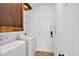 Functional laundry room featuring modern appliances and ample storage at 4309 Milford Pl, Hoschton, GA 30548