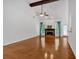 Bright living room with hardwood floors, vaulted ceilings, and a cozy fireplace at 4309 Milford Pl, Hoschton, GA 30548