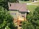 Spacious wooden deck overlooks the backyard and surrounding trees at 5737 Russell Ct, Douglasville, GA 30135
