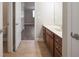 Bathroom featuring double vanity, tiled floors, and access to the bedroom at 5737 Russell Ct, Douglasville, GA 30135