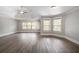 Large bedroom with tray ceiling, neutral paint, hardwood floors and bright natural light at 5737 Russell Ct, Douglasville, GA 30135