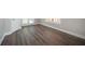Bedroom featuring new flooring, a private entrance to the exterior and a window to allow natural light at 5737 Russell Ct, Douglasville, GA 30135