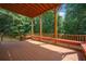 Outdoor deck with seating for entertaining, featuring a wood railing and peaceful wooded views at 5737 Russell Ct, Douglasville, GA 30135