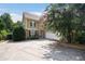 Charming home exterior featuring a two-car garage, well-manicured landscaping and a beautiful shade tree at 5737 Russell Ct, Douglasville, GA 30135