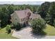 Charming two-story home featuring stone accents and mature landscaping at 5737 Russell Ct, Douglasville, GA 30135