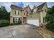 Spacious home with a two-car garage, stone accents, and a well-maintained front yard at 5737 Russell Ct, Douglasville, GA 30135