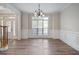 Bright living room featuring large window, crown molding, and hardwood floors at 5737 Russell Ct, Douglasville, GA 30135