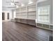 Spacious living room featuring built-in shelving, storage and large windows for natural light at 5737 Russell Ct, Douglasville, GA 30135