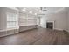 Spacious living room with hardwood floors, a fireplace, and built-in bookshelves at 5737 Russell Ct, Douglasville, GA 30135