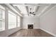 Bright and airy living room with coffered ceiling, hardwood floors, fireplace and large windows at 5737 Russell Ct, Douglasville, GA 30135