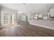 Open floor plan with wood floors, seamlessly connecting the kitchen and living spaces with light paint at 5737 Russell Ct, Douglasville, GA 30135