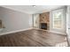 Cozy living room with hardwood floors and a stone fireplace at 5737 Russell Ct, Douglasville, GA 30135