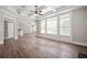 Spacious living room featuring a coffered ceiling, fireplace, and hardwood floors at 5737 Russell Ct, Douglasville, GA 30135