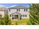 Back exterior view showing a patio and an expansive backyard at 6070 Arbor Green Cir, Sugar Hill, GA 30518
