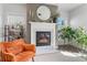 Stylish fireplace with marble hearth, providing a cozy and inviting focal point in the living space at 6070 Arbor Green Cir, Sugar Hill, GA 30518